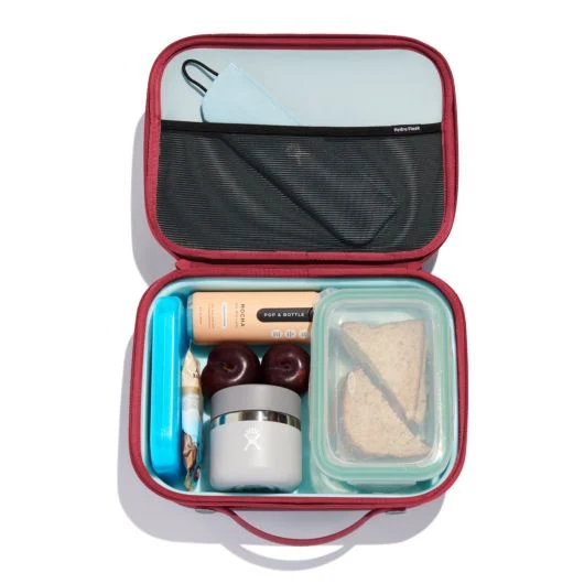 Hydroflask large lunch box opened to show a sandwich and other lunch items packed inside