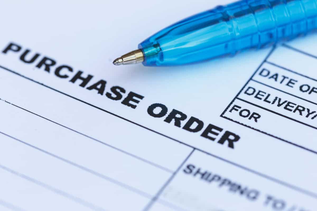 Image of a purchase order with pen on top